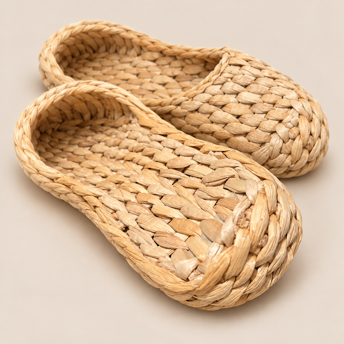 Handwoven Cattail Grass Slippers, House Shoes for Women, Eco-Friendly Indoor Sandals on a beige backdrop