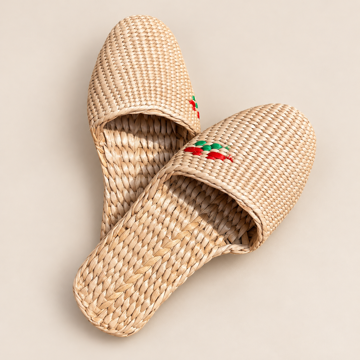 Handmade Straw Slippers: Eco-Friendly House Shoes on a beige backdrop