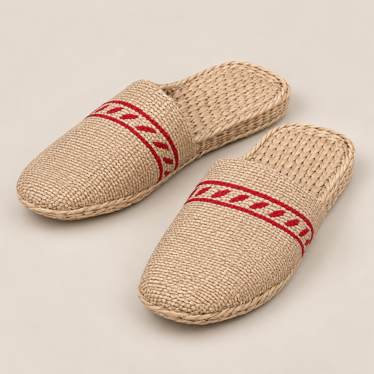 Handmade Natural Straw Slippers: Eco-Friendly House Shoes on a beige backdrop