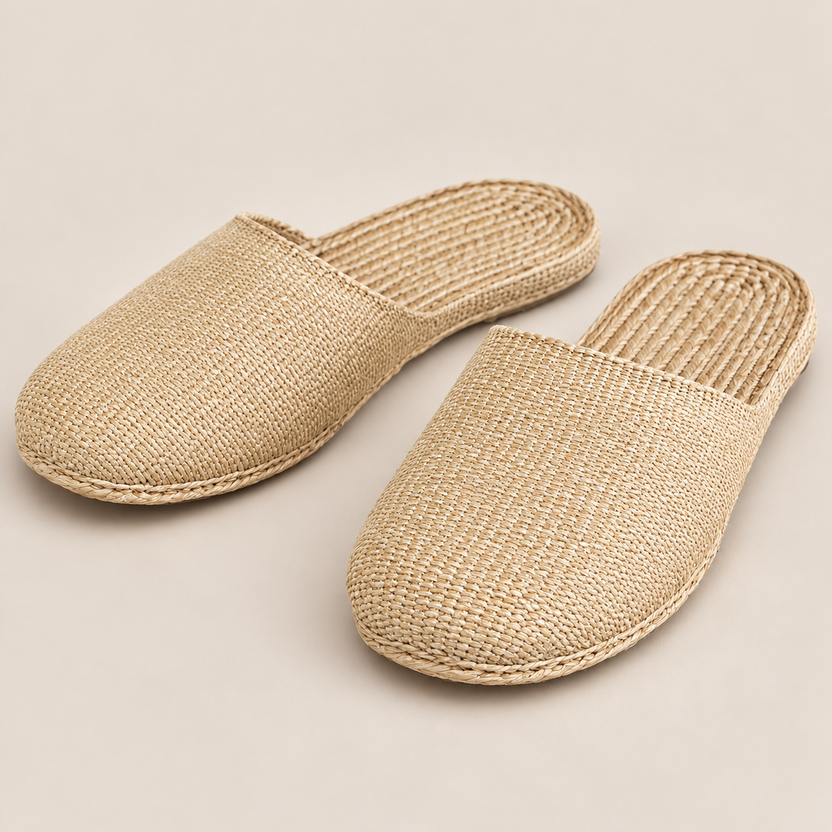 Handmade Woven Straw Slippers: All-Season Spa Shoes on a beige backdrop