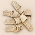 Handmade Straw House Slippers: Eco-Friendly All-Season Sandals on a beige backdrop