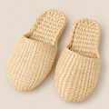 Handmade Straw Woven Slippers - Eco-Friendly House Sandals for Sustainable Comfort on a beige backdrop