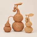 Handcrafted Woven Gourd Ornament: Natural Willow Decor on a beige backdrop