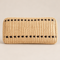 Handmade Woven Buckwheat Pillow: Natural Grass Fiber Neck Support on a beige backdrop