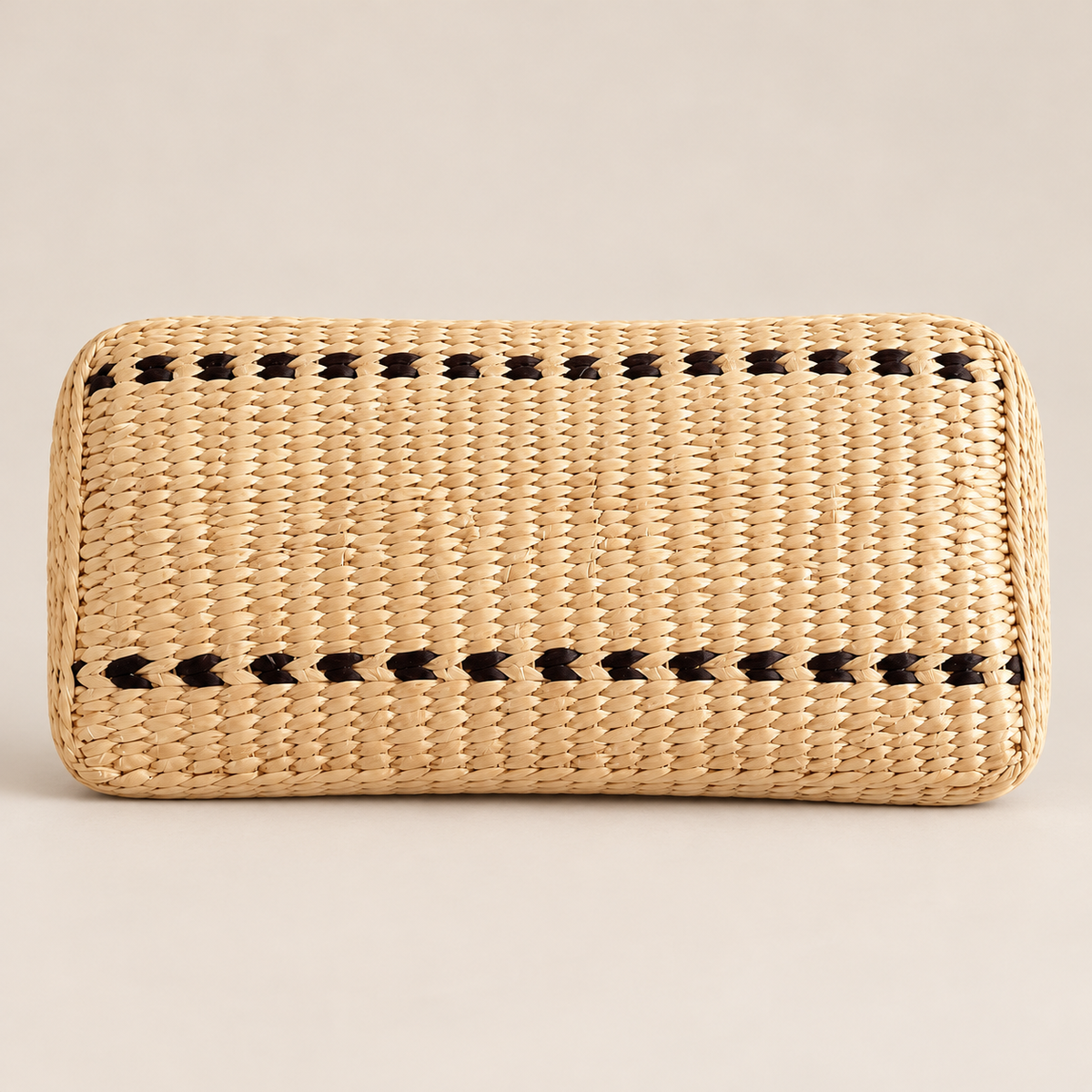 Handmade Woven Buckwheat Pillow: Natural Grass Fiber Neck Support on a beige backdrop