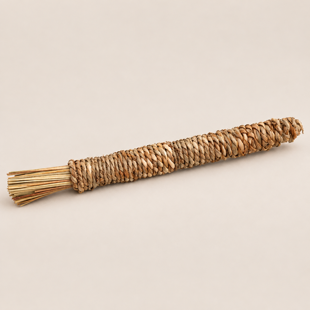 Natural Grass Chew Stick for Dogs: Handwoven Puppy Teething Toy on a beige backdrop
