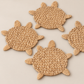 Handmade Turtle Placemat, Woven Water Hyacinth Table Mat, Coastal Kitchen Island and Dining Placemats on a beige backdrop