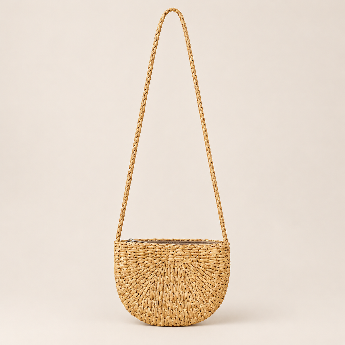Handmade Woven Crossbody Bag, Zippered Boho Shoulder Purse, Lined Summer Beach Bag, Water Hyacinth Travel Purse on a beige backdrop