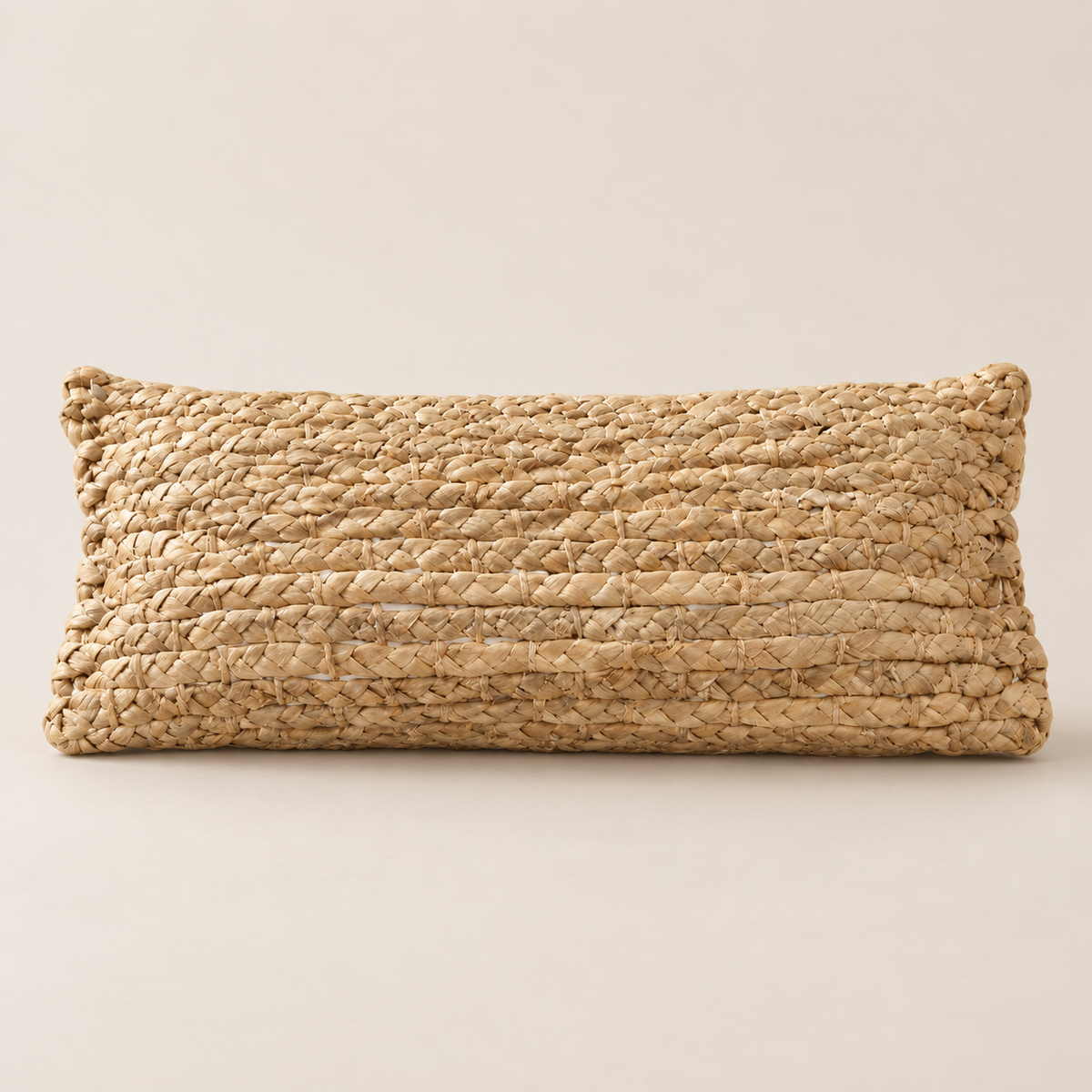 Handwoven Water Hyacinth Neck Pillow, Natural Bolster Pillow for Neck and Back Support, Firm Woven Bed Rest on a beige backdrop