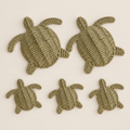 Handmade Turtle Wall Decor, Woven Sea Turtle Coastal Wall Art, Paper Rope Beach House Decor on a beige backdrop