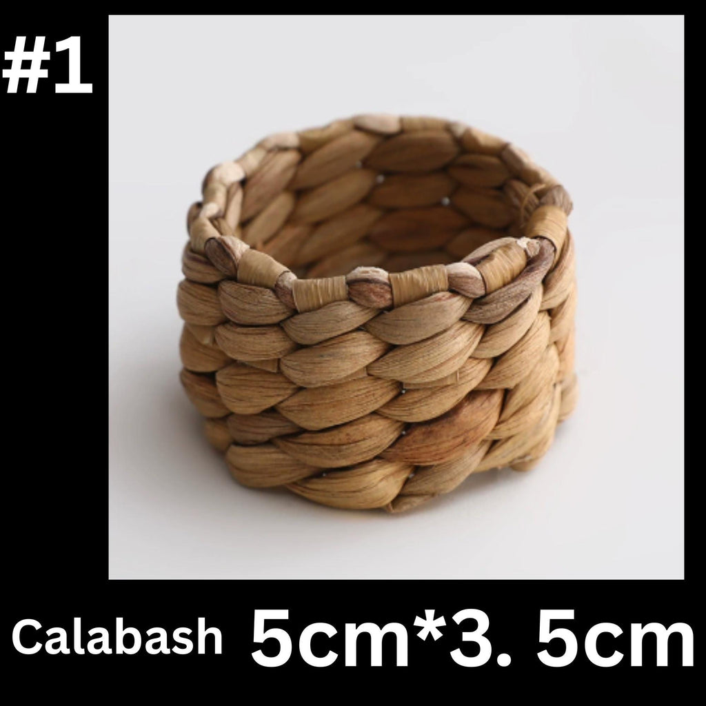 A woven basket made of natural materials, such as straw or reeds, with a textured and intricate design.