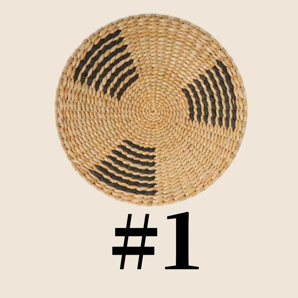 a woven basket with a black and white pattern on it.