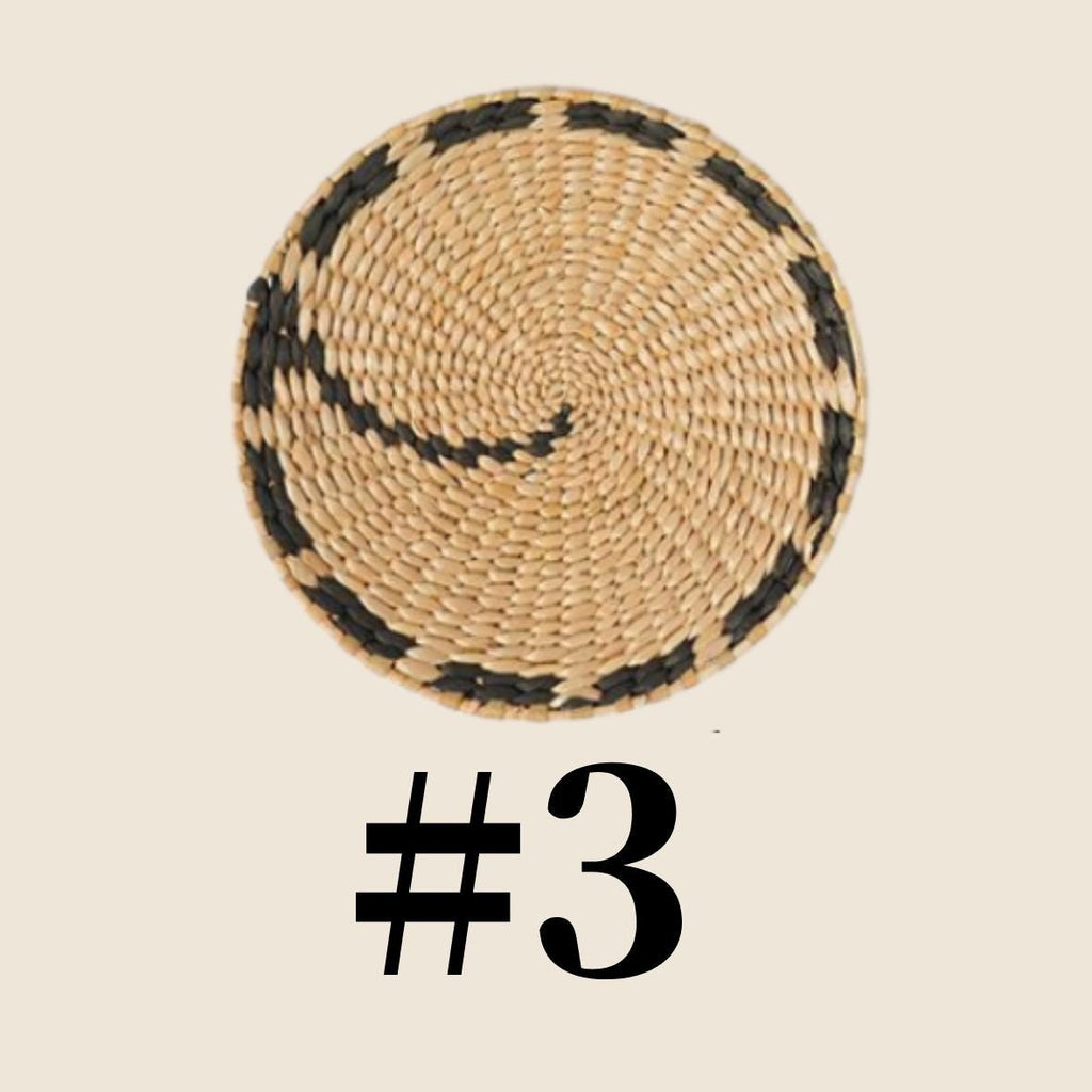 a woven basket with a black and white pattern around the edge.