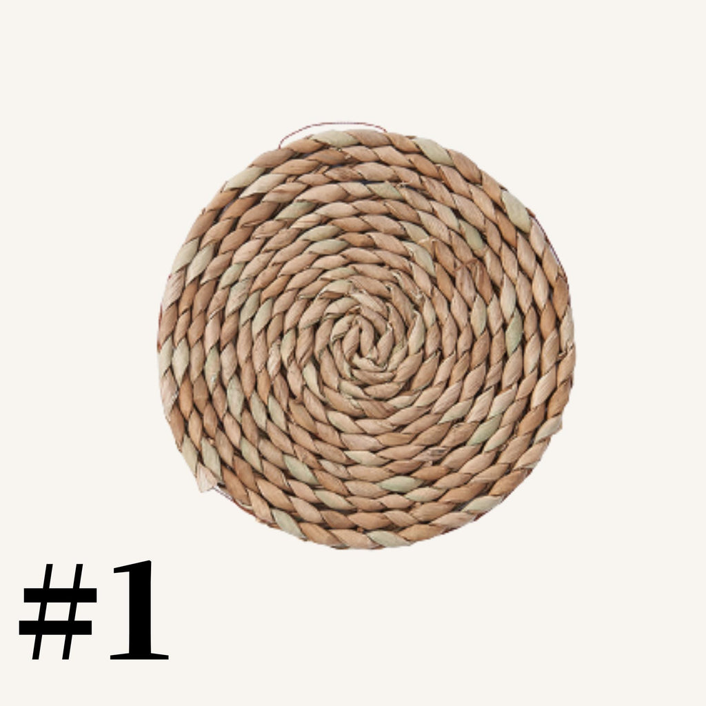A woven basket with a spiral pattern, numbered 1.