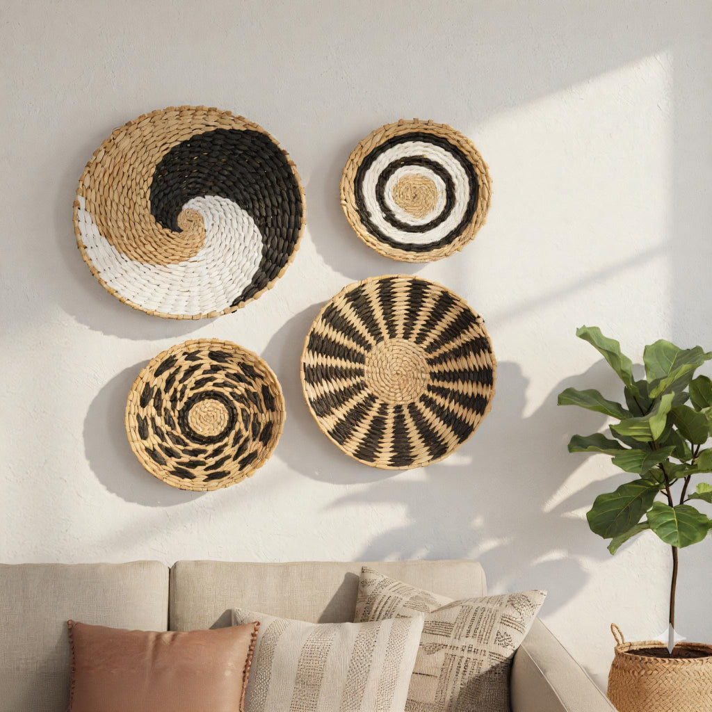 a cozy living room with a beige sofa and a potted plant. The walls are adorned with four decorative woven baskets in various patterns, including a circular pattern, a striped pattern, and a more abstract design.