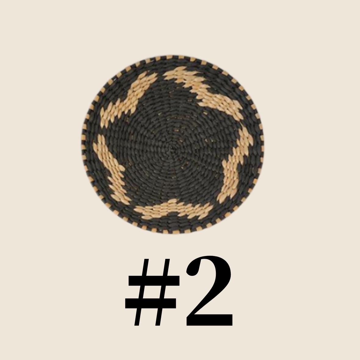 a black and white woven basket with a star-shaped pattern on it.