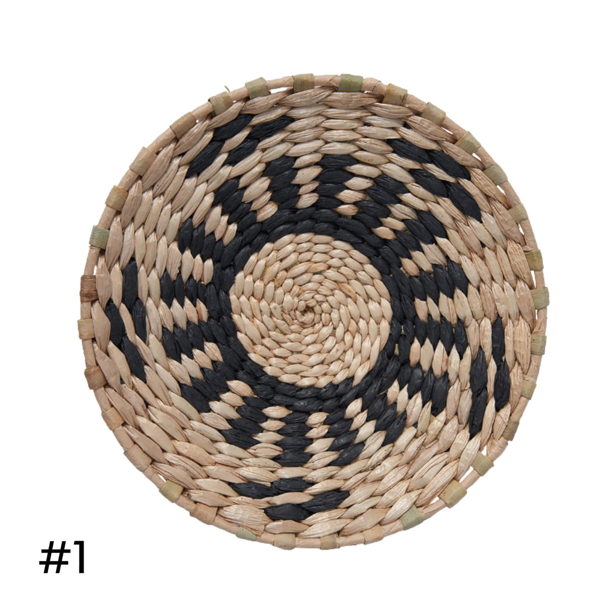 a woven basket with a black and white pattern, featuring a circular design in the center.