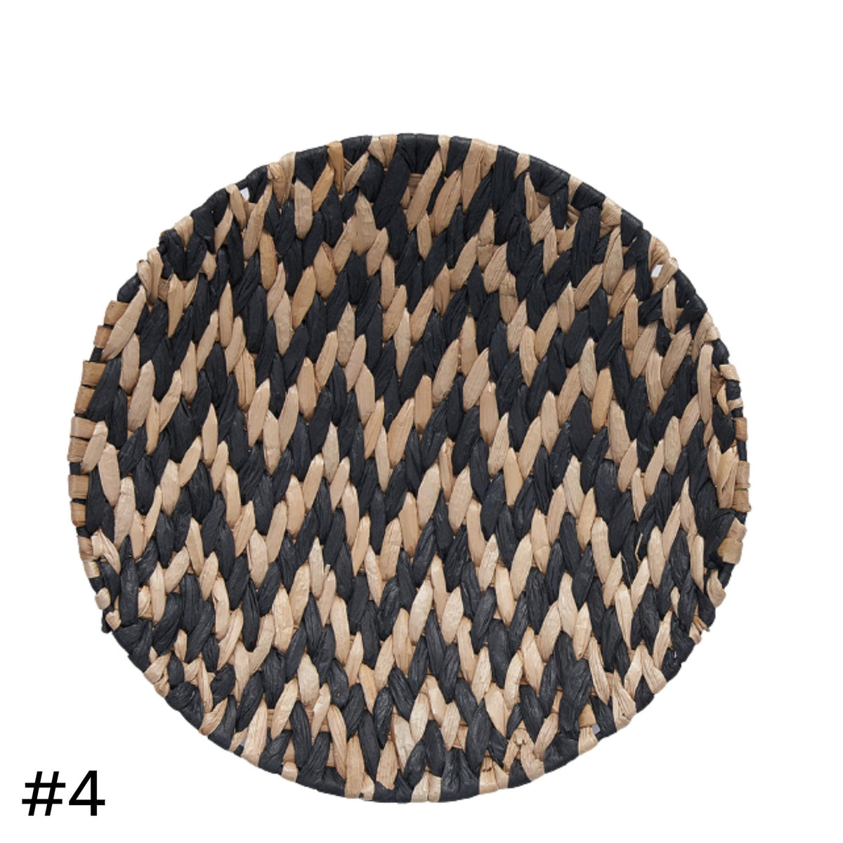 a round, oval-shaped woven basket with a zigzag pattern in black and beige colors.