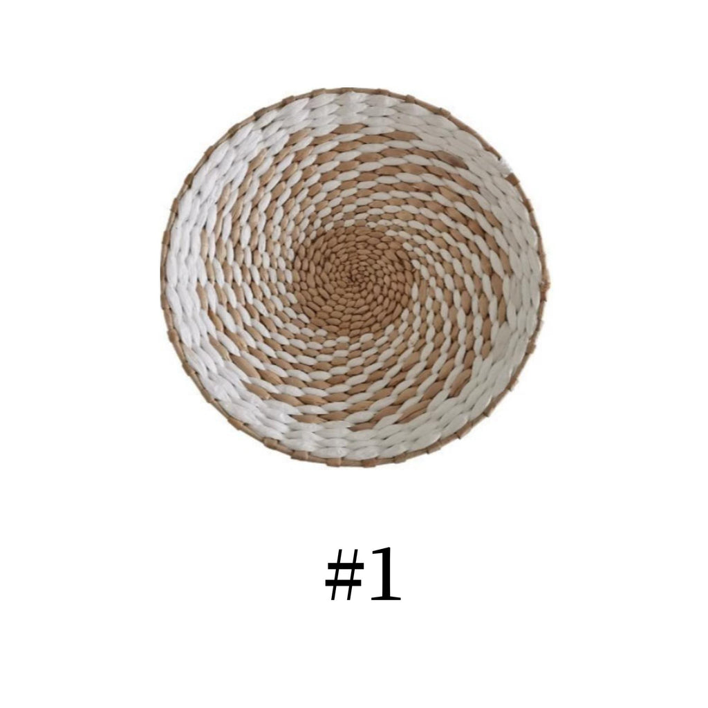 A woven basket with a spiral pattern, featuring a white and brown color scheme.