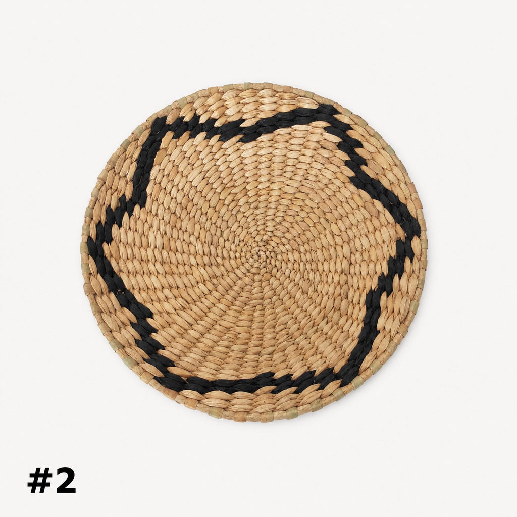 A woven basket with a black border, placed against a white background.