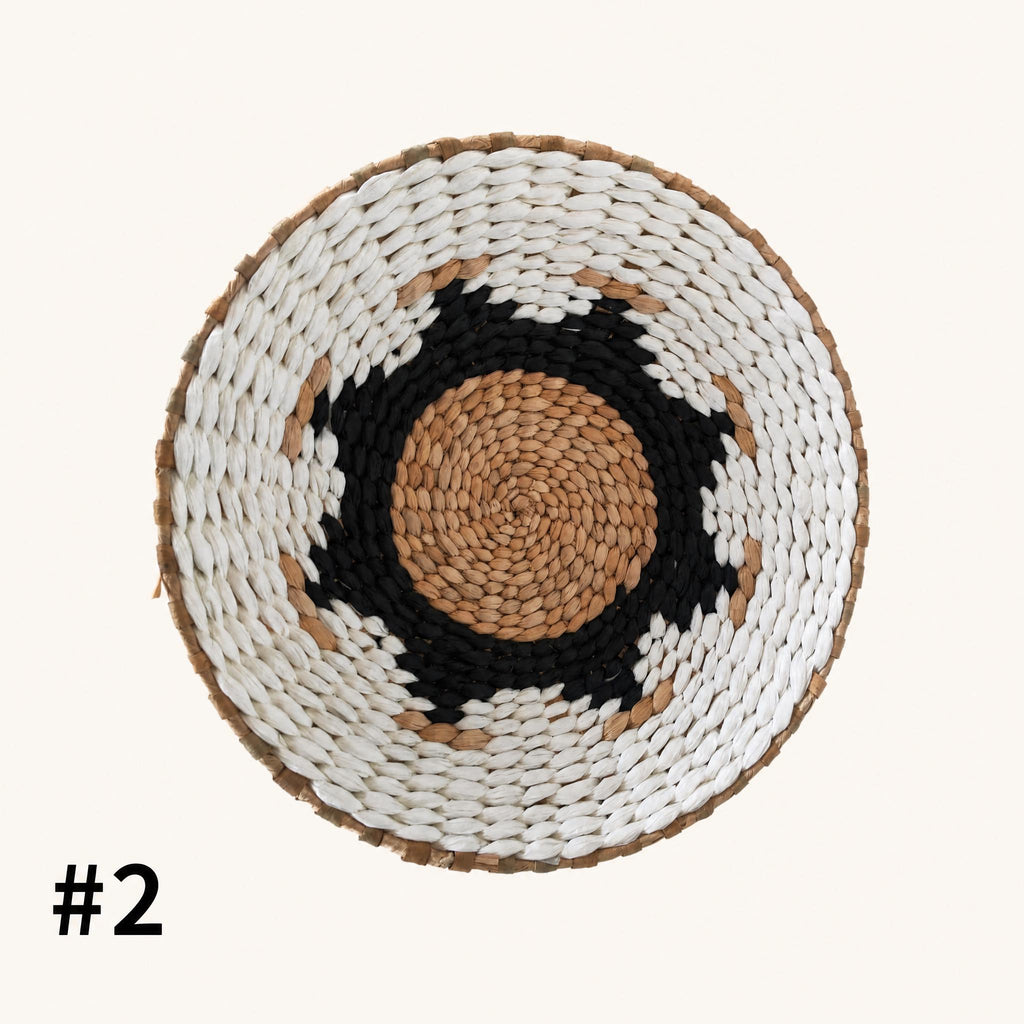 a woven basket with a black and white pattern around the center.