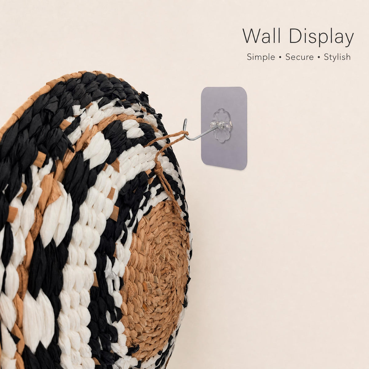 a wall display with a woven basket or mat hanging on it. The display is simple, secure, and stylish, with a neutral color palette and a text overlay that reads "Wall Display" and "Simple + Secure + Stylish".