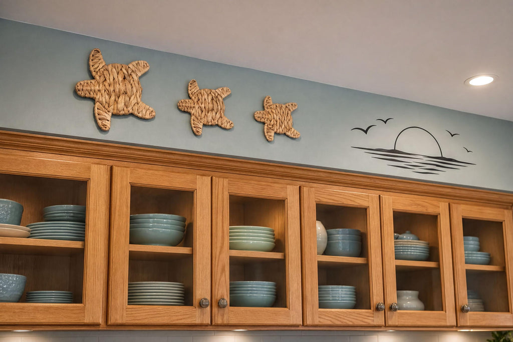 a kitchen cabinet with various blue plates and bowls stored inside. Above the cabinet, there are three starfish-shaped wall decorations.
