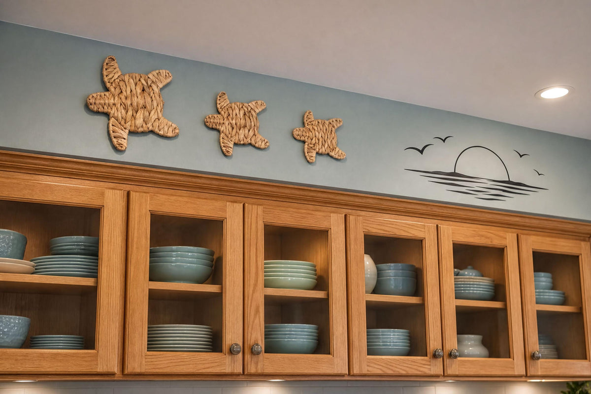 a kitchen cabinet with various blue plates and bowls stored inside. Above the cabinet, there are three starfish-shaped wall decorations.