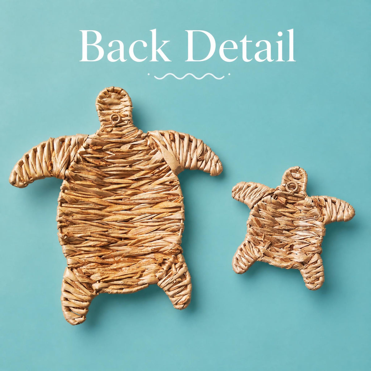 two woven turtle-shaped objects against a teal background.