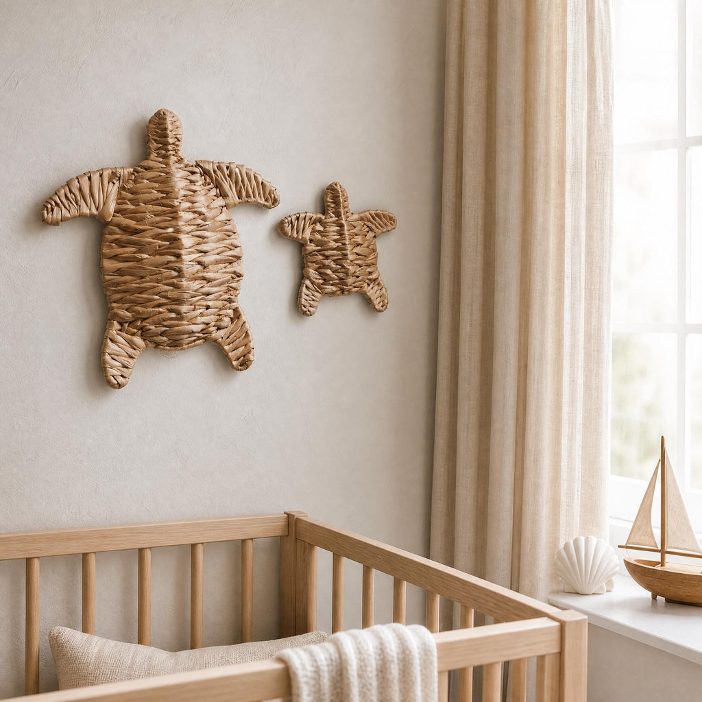 a serene nursery scene with a wooden crib, a small sailboat, and two woven turtle-shaped wall decorations.