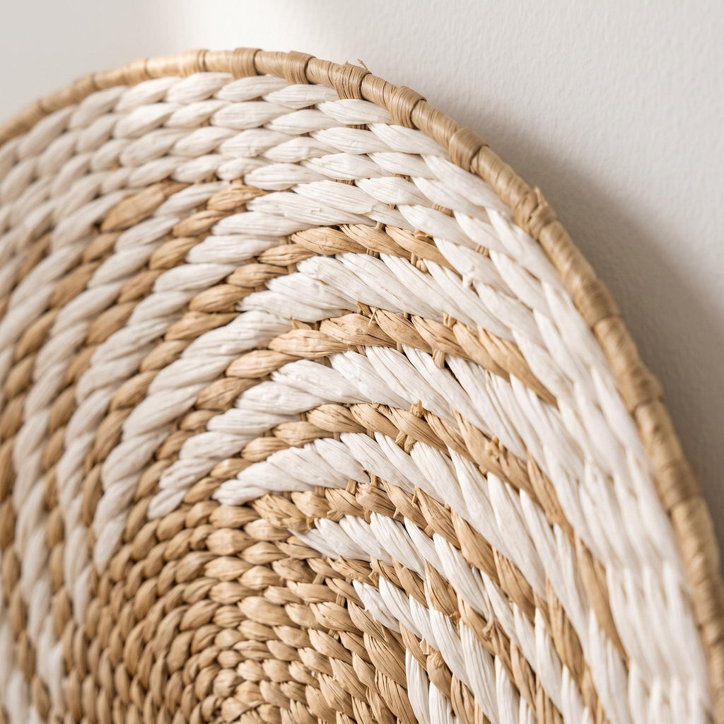 Close-up of the woven water hyacinth wall basket showing natural and white fiber coils