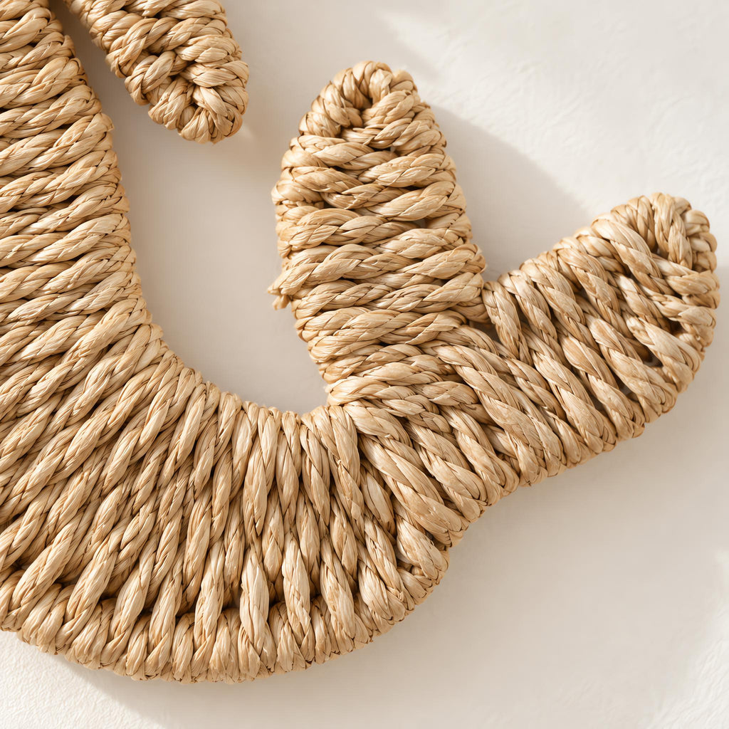 Close-up of the handwoven paper rope texture of the mermaid wall decor