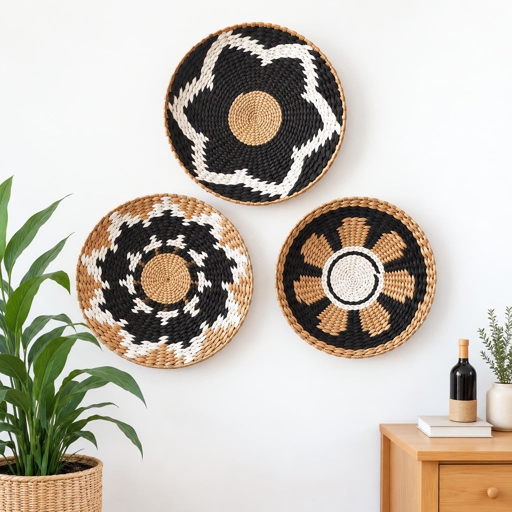 Set of 3 handwoven boho wall baskets with star and flower-center patterns in black, white and natural tan, for boho living room and rustic home decor