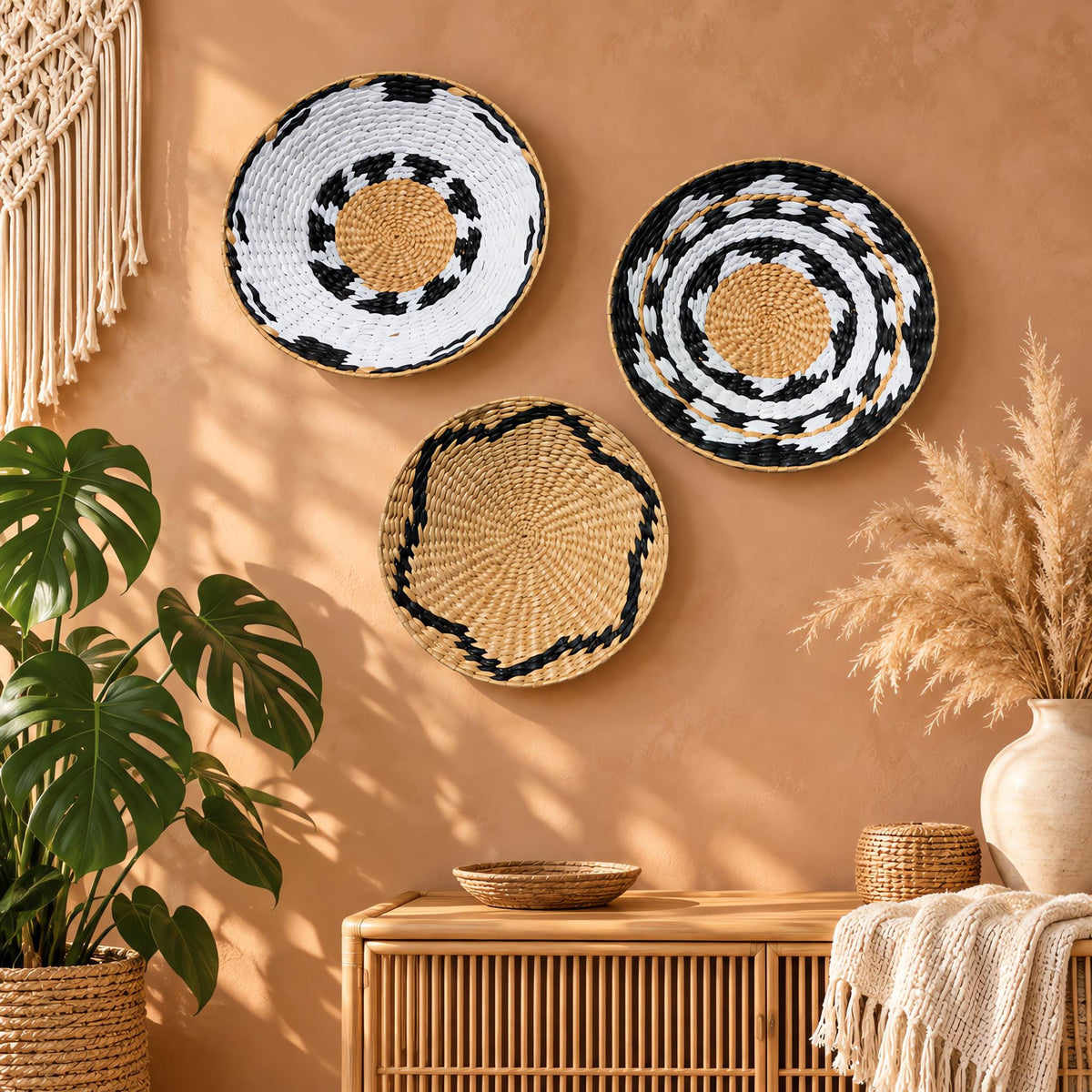 Set of 3 handwoven boho straw wall baskets, natural and black patterns, terracotta wall styling for boho coastal home decor