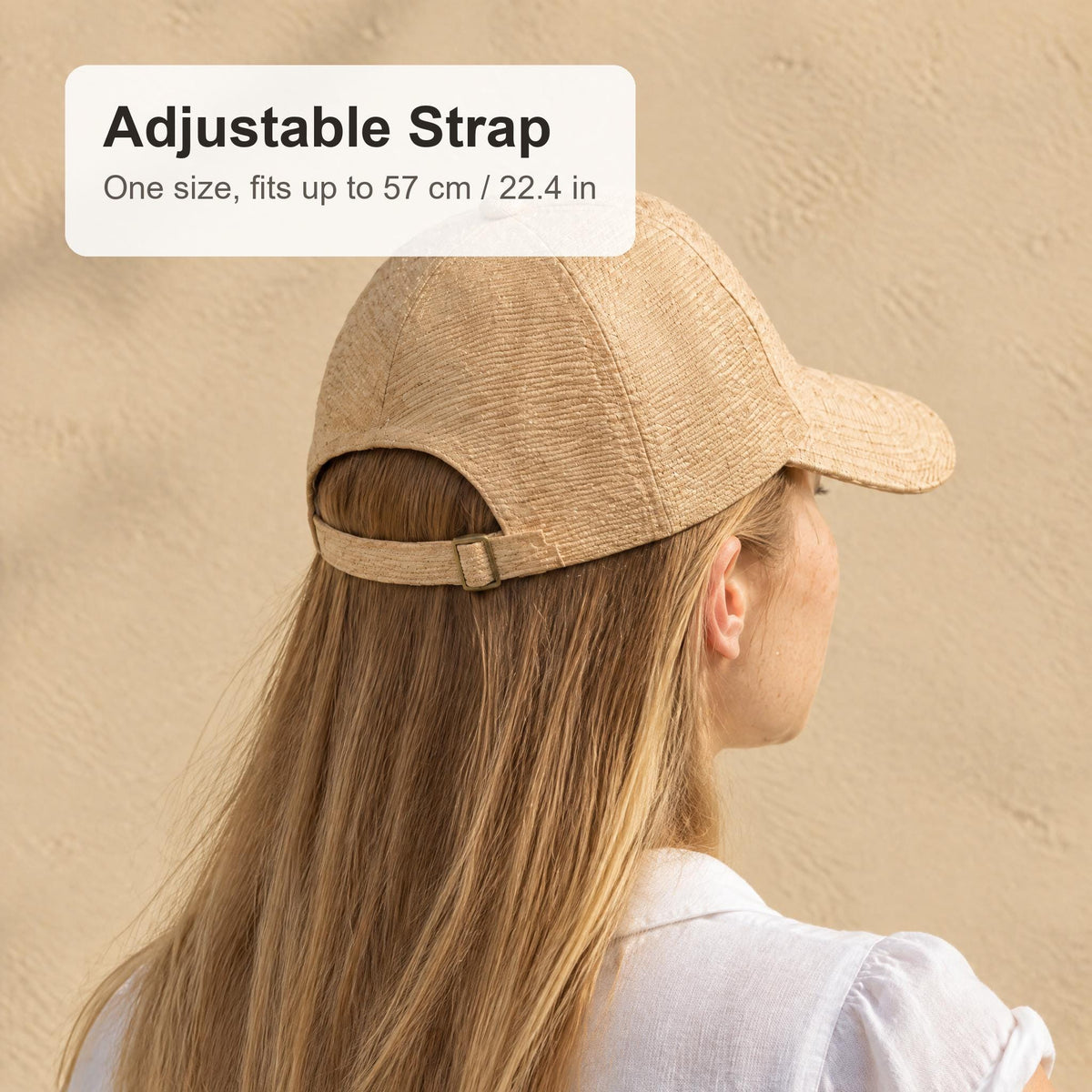 Back view of the raffia straw cap showing the adjustable strap, one size fits up to 57 cm / 22.4 in