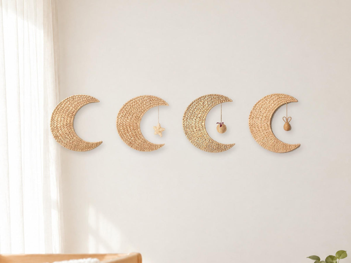 Handwoven water hyacinth and corn husk crescent moon wall decor on a nursery wall, four styles shown side by side: moon only, moon with star, Xmas ball and rabbit ball; each option is one moon